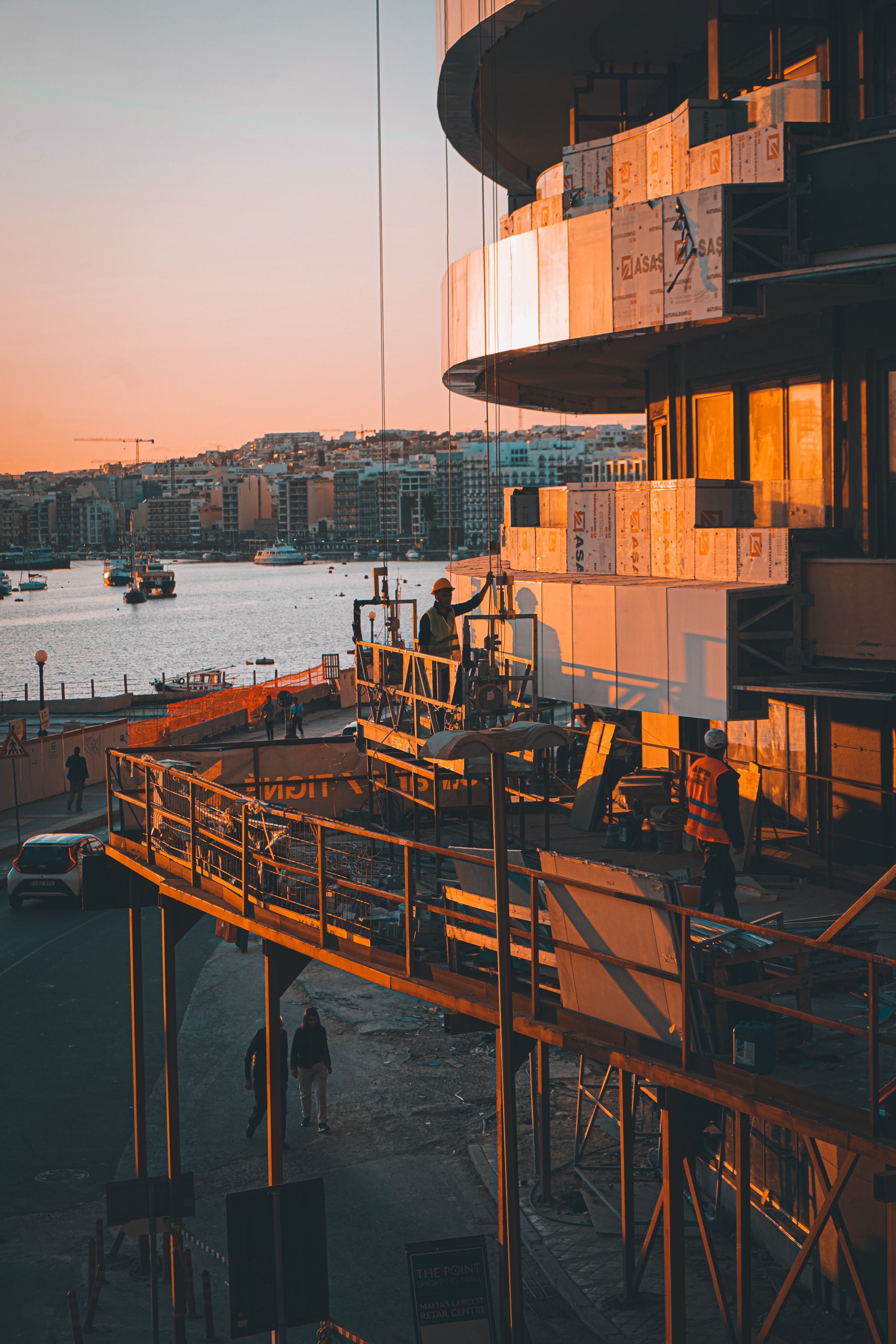 Construction workers on a waterfront building project